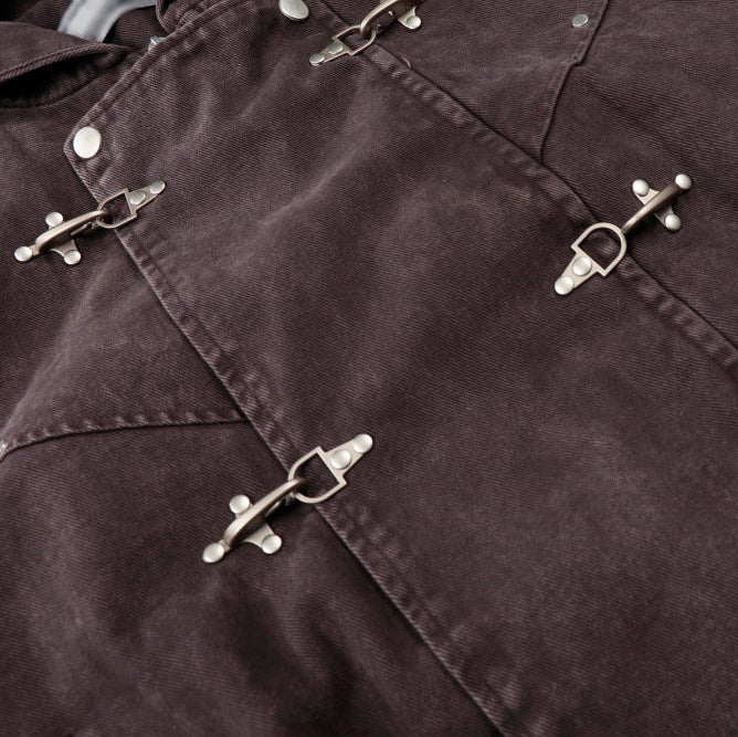 Close up detail of ARC DuneLock jacket metal clasp hardware and cotton fabric texture