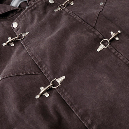 Close up detail of ARC DuneLock jacket metal clasp hardware and cotton fabric texture