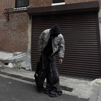 Model wearing RuinForm gray retro streetwear flight jacket in urban street setting