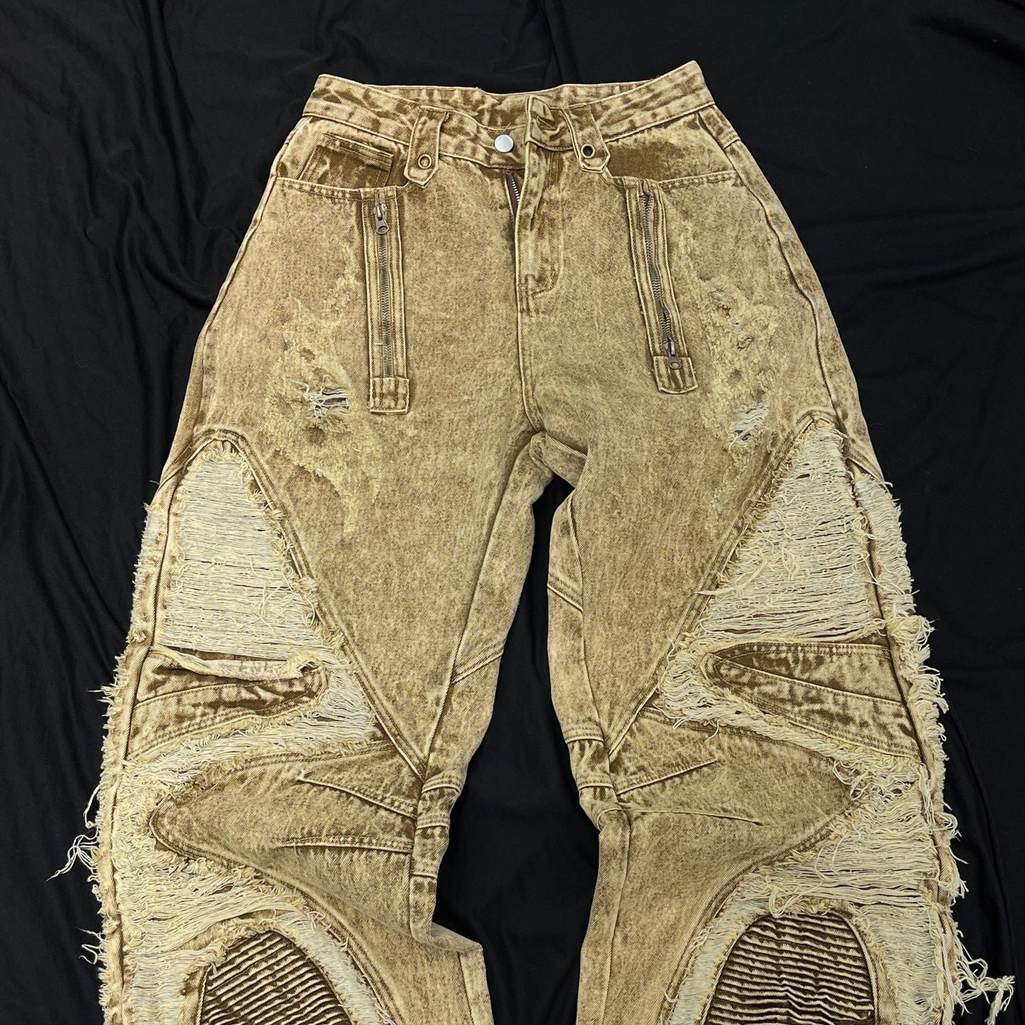 BladeWasteland streetwear pants front view with distressed ripped panels zipper pockets and desert yellow washed denim