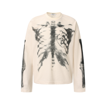 Apricot GravePrint skeleton graphic long sleeve tee with rib cage artwork and oversized streetwear fit