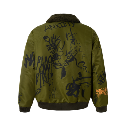 Combat olive graffiti print streetwear winter jacket back view with bold WarScript graphic design and ribbed hem