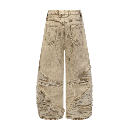 BladeWasteland distressed streetwear pants back view in desert yellow washed denim with ripped panel design