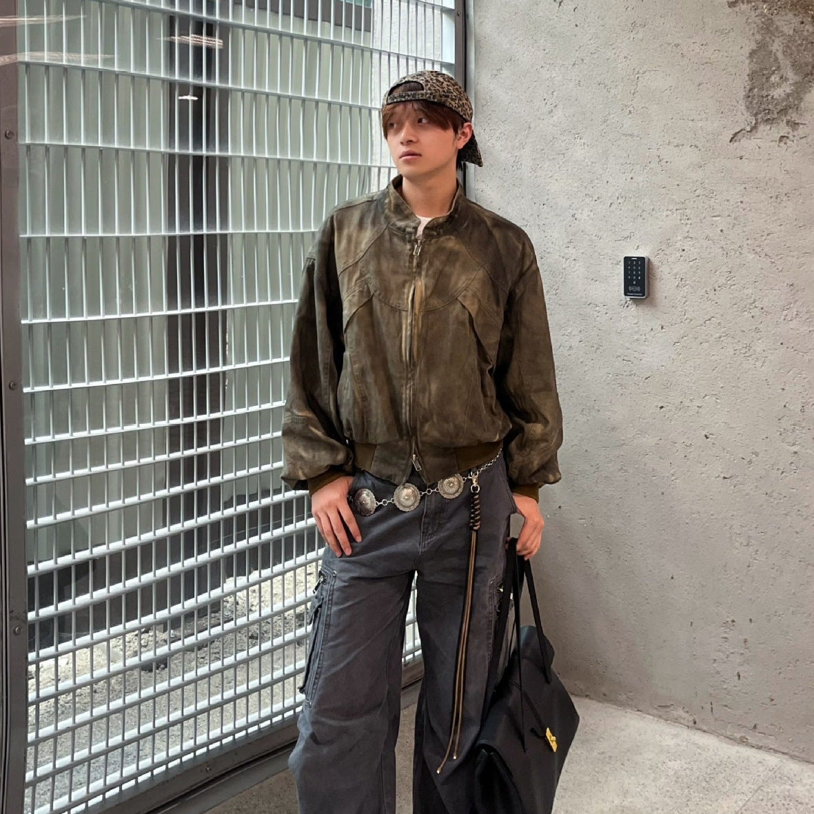 Model wearing ARC ModRogue vintage brown streetwear jacket with loose fit urban style