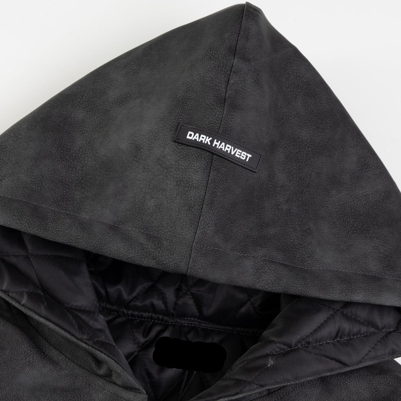 Close up detail of ARC NightDye jacket hood showing Dark Harvest label and quilted inner lining