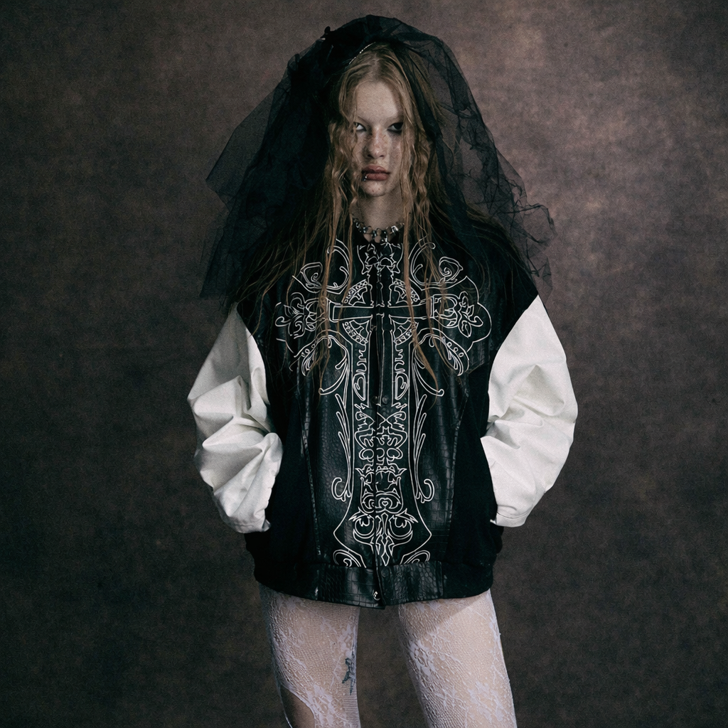 Model wearing BlackSanctum gothic streetwear jacket with cross graphic design