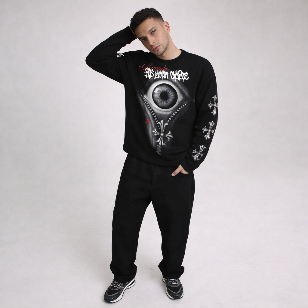 Model wearing black VoidVision graphic long sleeve streetwear shirt with eye print design and relaxed fit